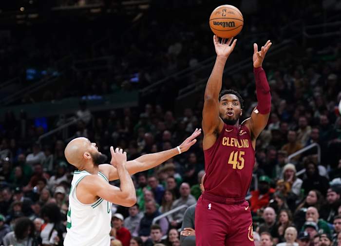Dec 12, 2023; Boston, Massachusetts, USA; Cleveland Cavaliers guard Donovan Mitchell (45) shoots against Boston Celtics guard Derrick White (9) in the second quarter at TD Garden.